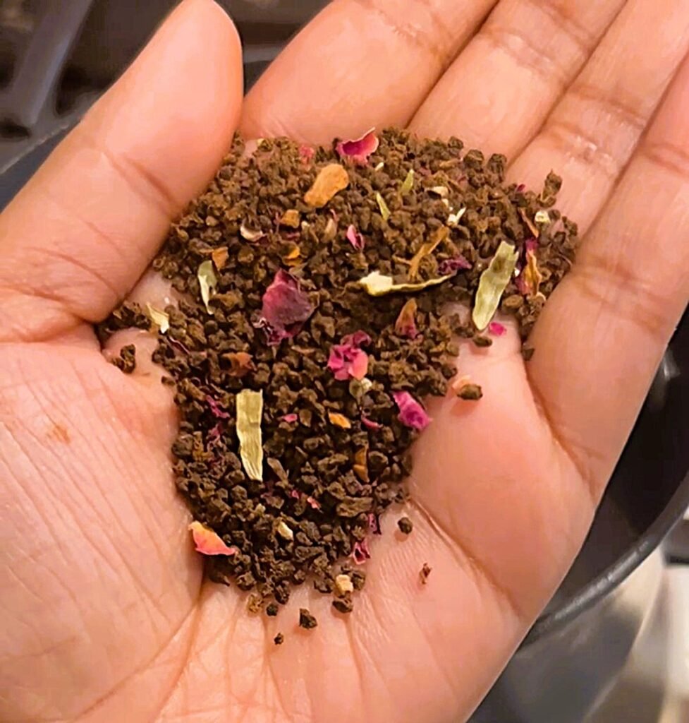 Holding the rose masala chai mix in my hand.